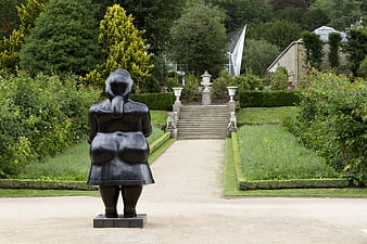 Black Sculpture in Formal Garden with Stone Stairs