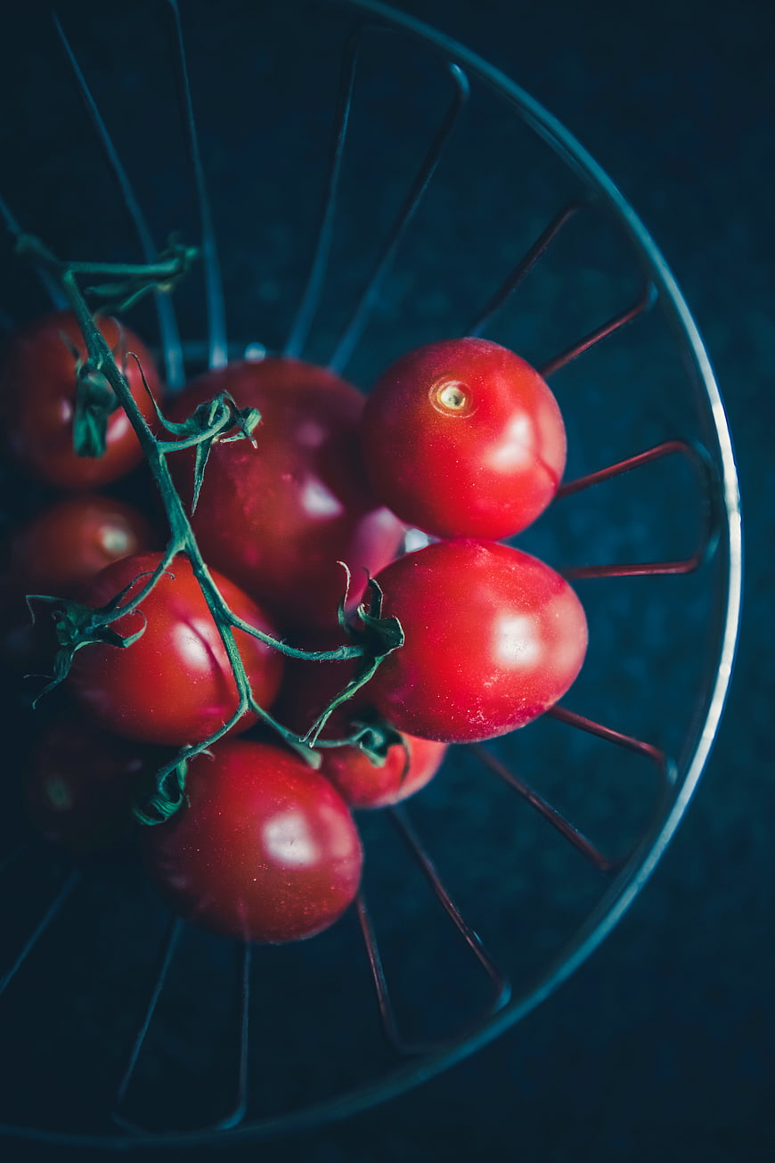 Fresh Red Tomatoes on the Vine in a Wire Basket