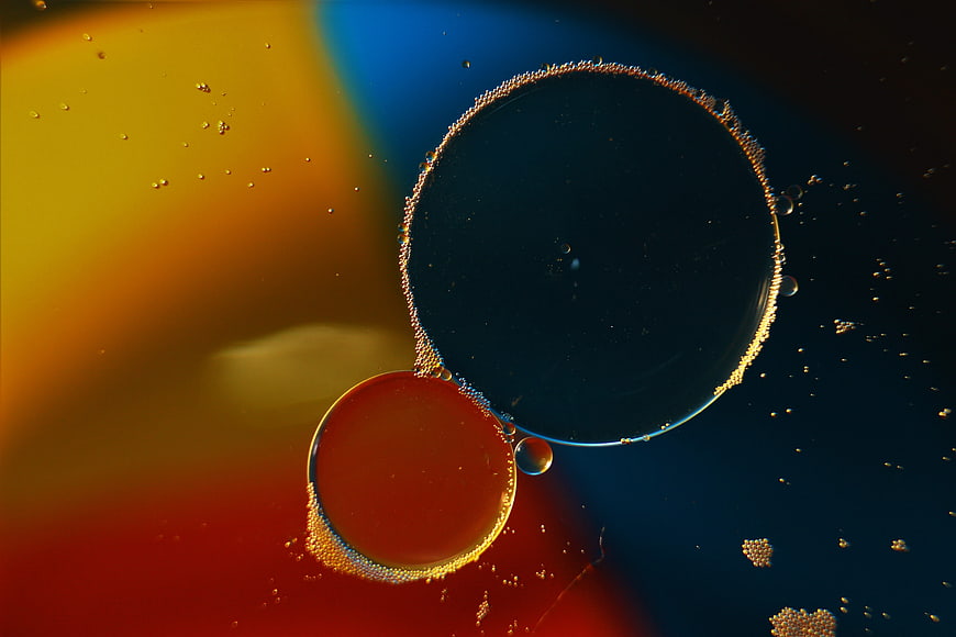 Abstract macro photography of oil and water bubbles with vibrant colors