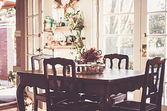 Cozy Dining Room with Wooden Table and Autumn Decor