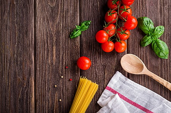 Fresh Italian pasta ingredients on rustic wooden table