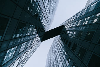 Low angle view of modern skyscrapers connected by a skybridge