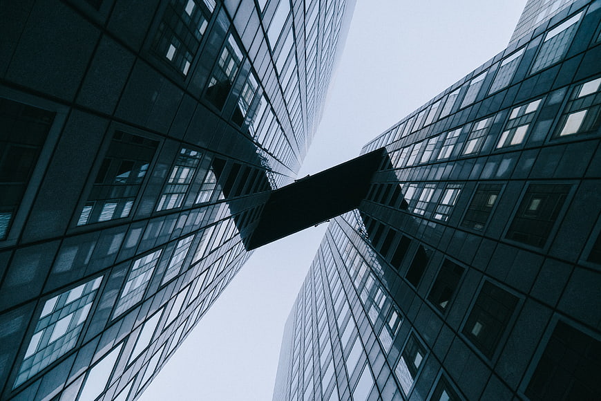 Low angle view of modern skyscrapers connected by a skybridge