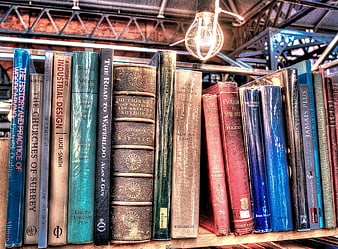 Vintage Books on Wooden Shelf with Hanging Light Bulb
