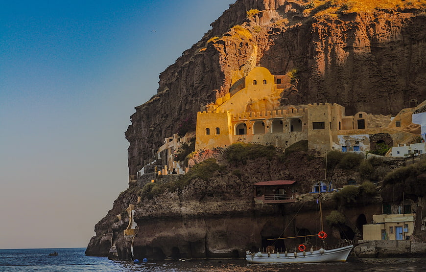 Sunlit Monastery on Cliffside in Santorini, Greece