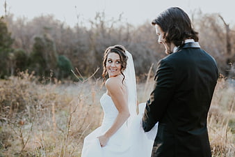 Happy Bride and Groom in Outdoor Field