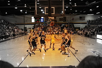 College Basketball Game Action Shot in Indoor Gymnasium