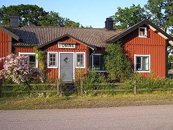 Red wooden Torne train station building in Sweden