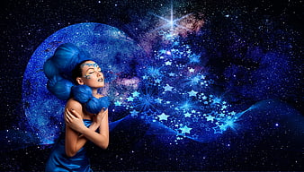 Fantasy woman with blue hair and galaxy makeup exhaling stars