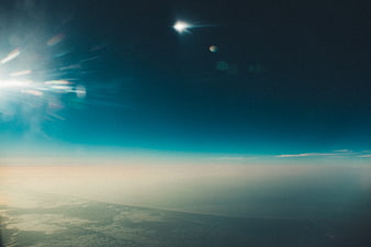 Aerial View of Earth's Atmosphere with Sun Flare