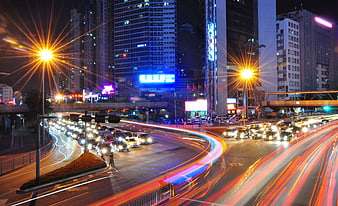 Nighttime City Traffic Light Trails and Urban Skyline