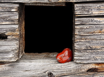 Red Heart Stone in Rustic Wooden Window Frame