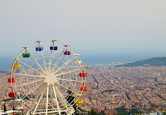 Ferris Wheel Overlooking Barcelona Cityscape And Mediterranean Sea