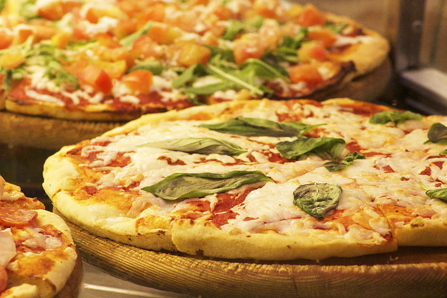Fresh Italian Pizzas With Basil And Mozzarella On Wooden Boards