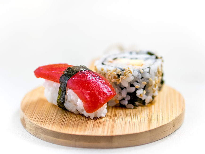 Fresh Tuna Nigiri and Sesame Sushi Roll on Wooden Board