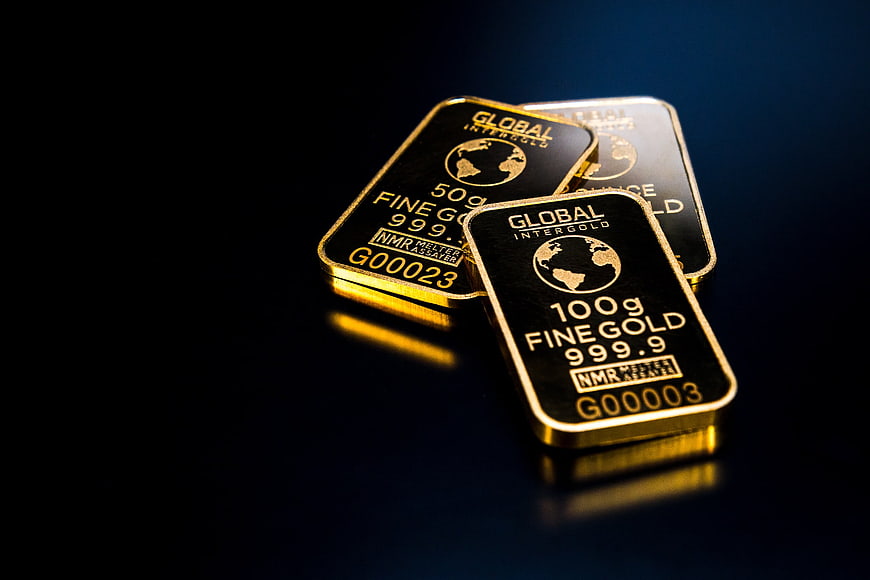 Stack of gold bars on dark background
