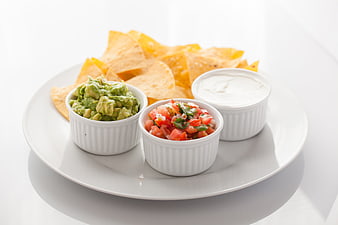 Mexican Appetizer Platter With Guacamole, Salsa, Sour Cream, And Tortilla Chips