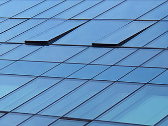 Abstract Blue Glass Building Facade with Grid Pattern