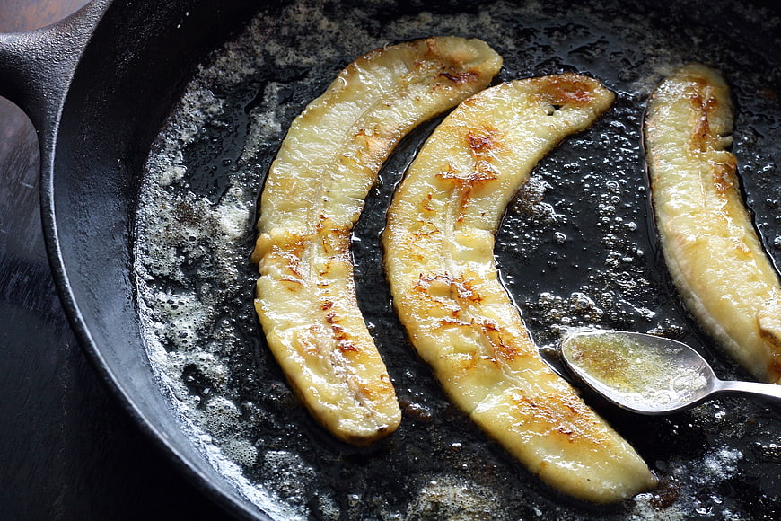 Caramelized Bananas Cooking in Cast Iron Skillet