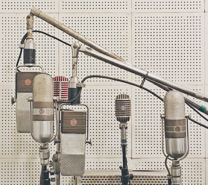 Vintage Microphones on Perforated Studio Wall