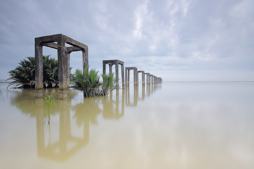 Concrete Pillars in Flooded Water with Reflections