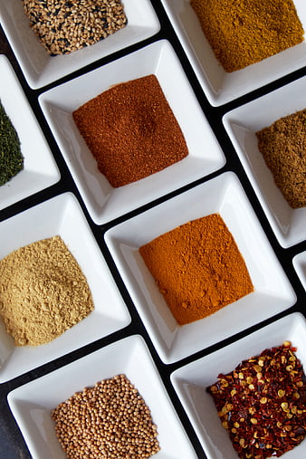 Top View of Various Spices in White Square Bowls