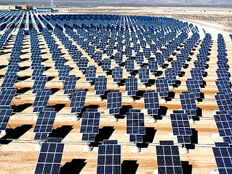 Aerial View of Large Solar Panel Array in Desert Landscape