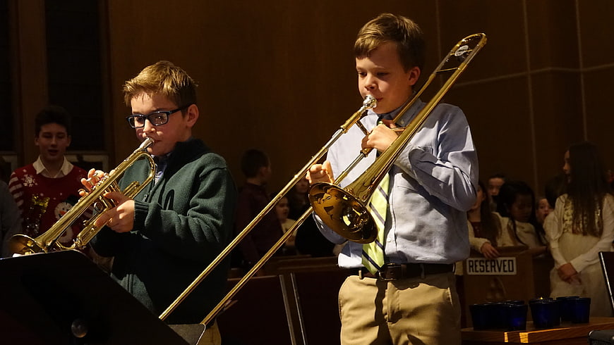 Young Boys Playing Trumpet and Trombone at School Concert