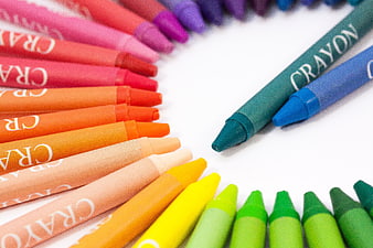 Colorful Crayons Arranged in a Circle on White Background