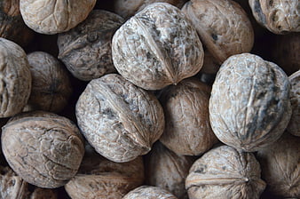 Close-up of whole walnuts with textured shells