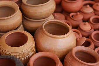 Collection of handmade terracotta clay pots and jars
