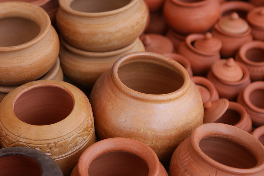 Collection of handmade terracotta clay pots and jars
