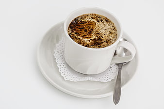 White Cup of Black Coffee on Saucer with Spoon