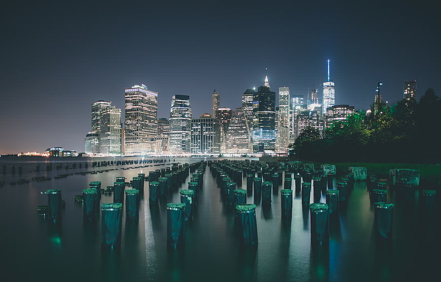 New York City Skyline at Night with Water Reflections