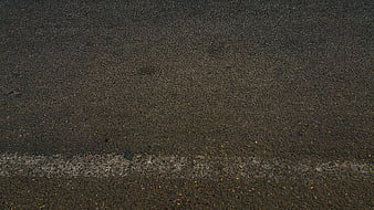 Dark Asphalt Road Surface Texture With Faded White Line