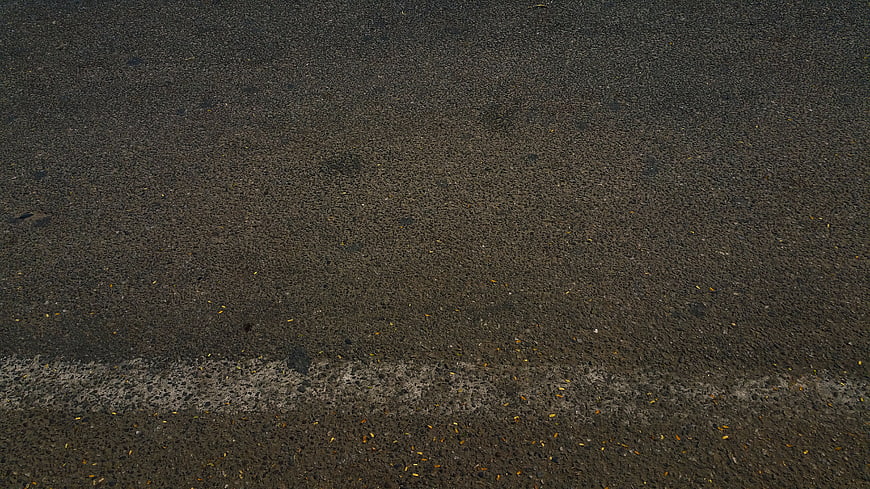 Dark Asphalt Road Surface Texture With Faded White Line