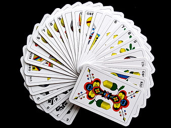 Fanned Deck of German Playing Cards on Black Background