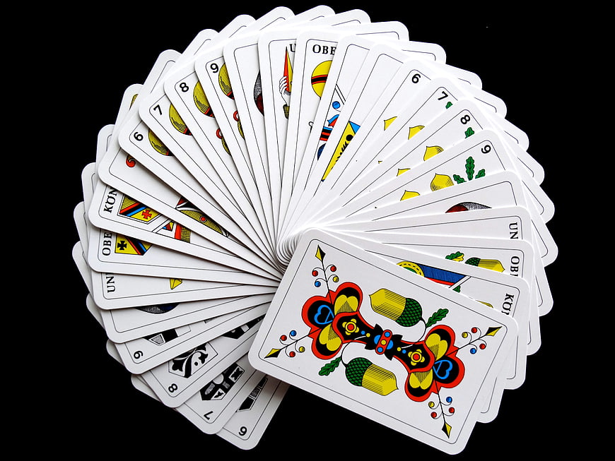 Fanned Deck of German Playing Cards on Black Background