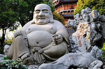 Laughing Buddha Stone Statue In Chinese Temple Garden