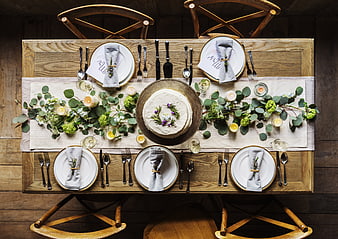 Rustic Wedding Table Setting with Cake and Floral Centerpiece