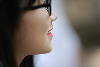 Close-up profile of smiling woman with glasses