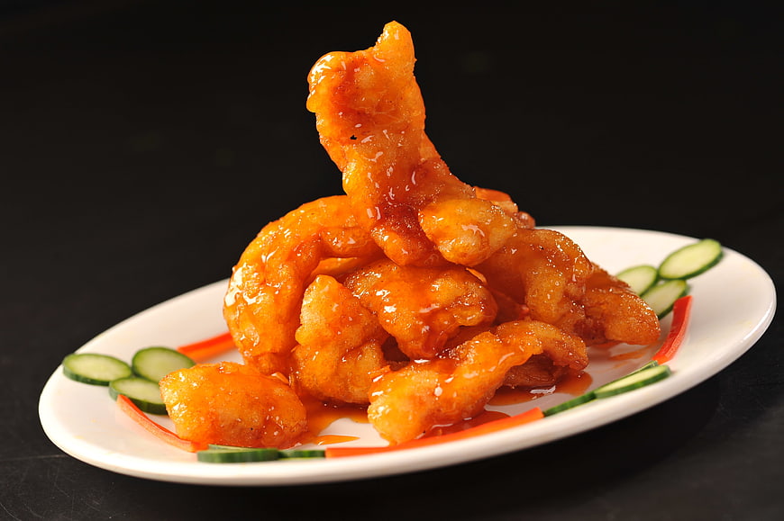 Glossy Orange Glazed Fried Pork on White Plate