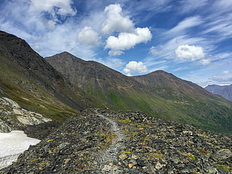 Rocky Mountain Ridge Trail with Blue Sky and Clouds
