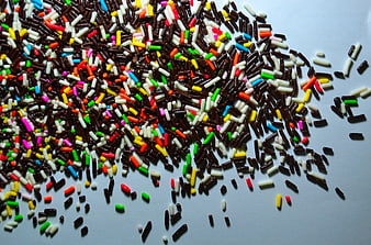 Colorful Sprinkles Scattered On White Surface