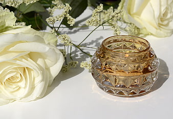 Elegant Amber Glass Candle Holder with White Roses