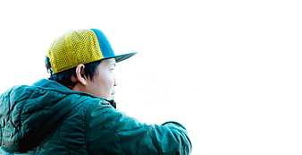 Man in Yellow Cap Looking Right on White Background