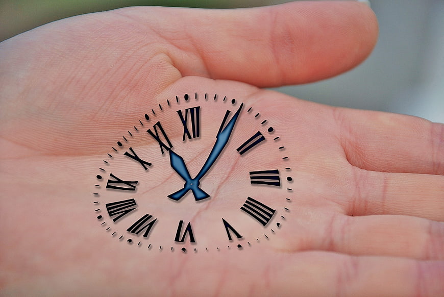 Clock Face Superimposed On Open Human Palm