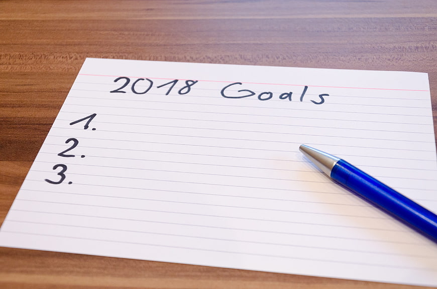 2018 Goals handwritten on lined paper with blue pen