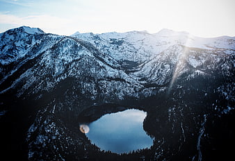 Aerial View of Snow-Covered Mountains and Alpine Lake