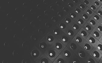Abstract black and white architectural pattern with circular holes